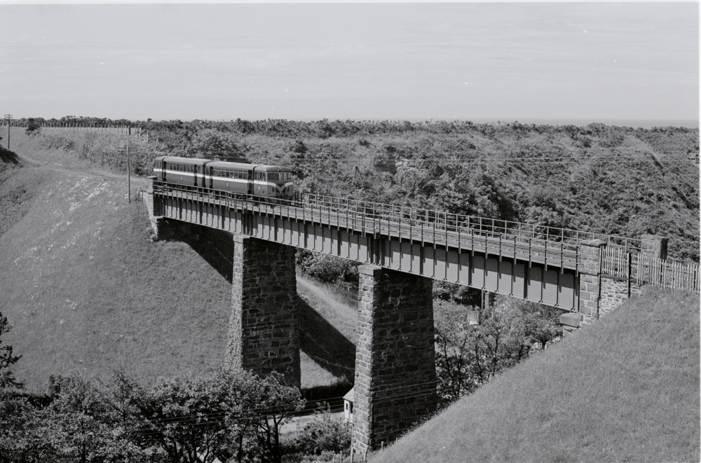 The ex-County Donegal Railways diesel cars Nos. 19 and 20 cross Glen Wyllin viaduct with a service to Ramsey in August 1964